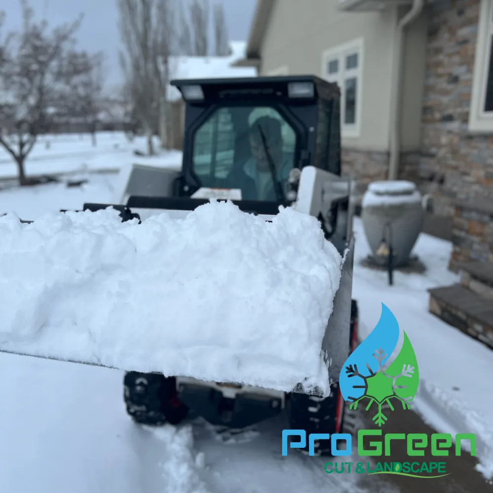 Skid steer clearing snow